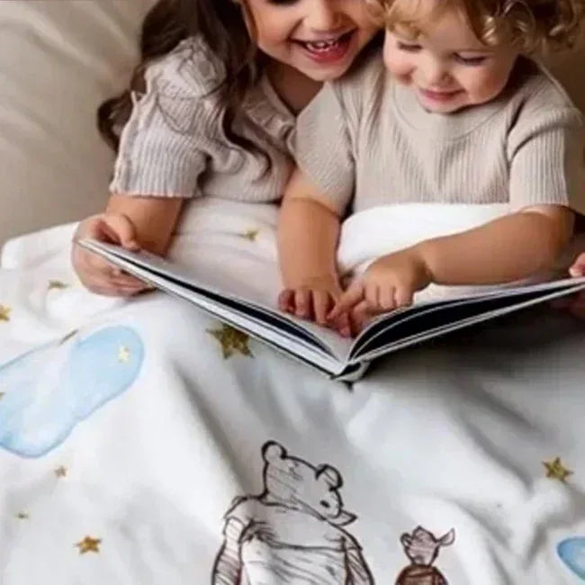 Winnie the Pooh Sweet Dream blanket styled in a storybook nursery, premium baby room decor.