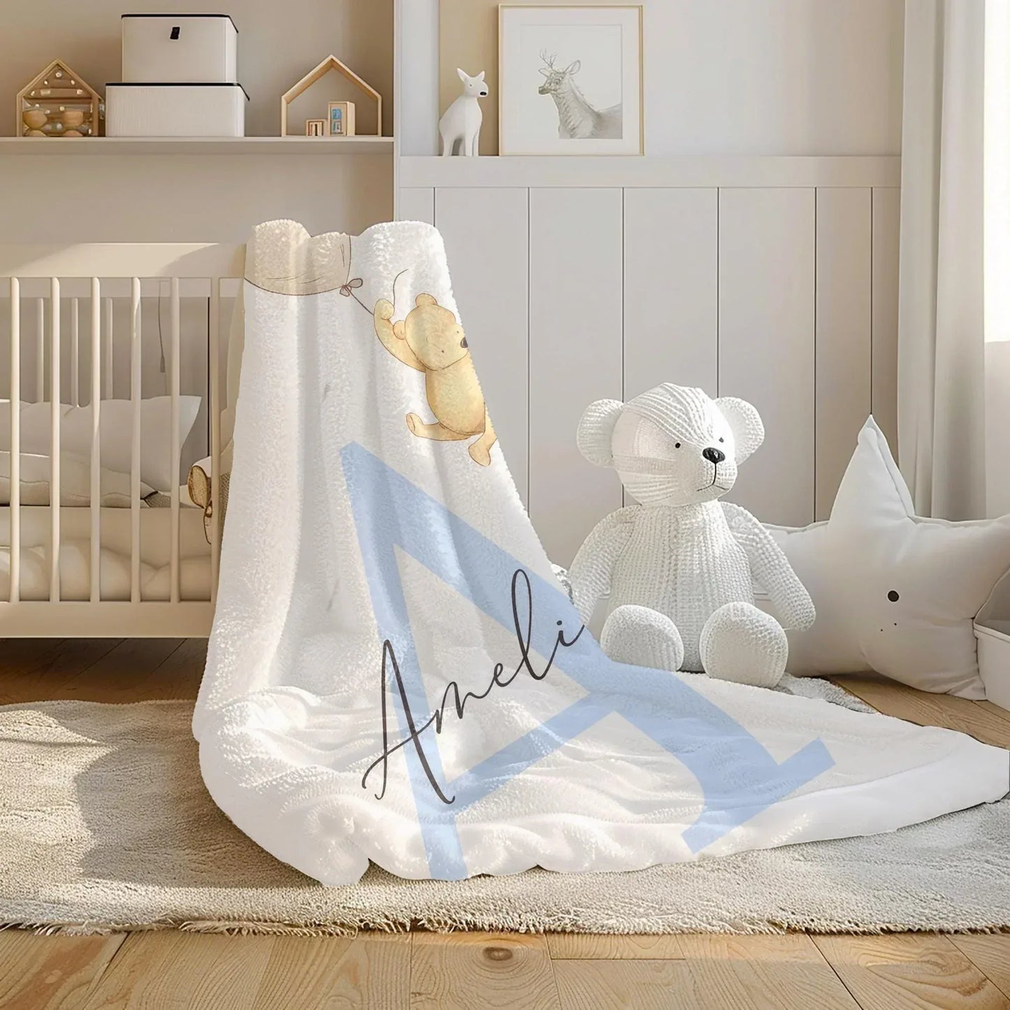 Classic Pooh Adventure blanket styled in an elegant, neutral-toned baby nursery.