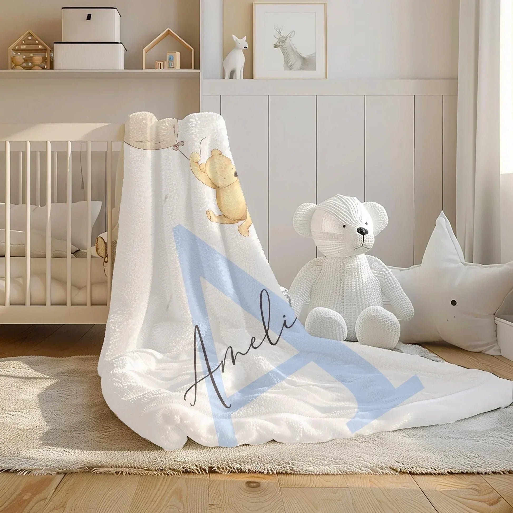 Classic Pooh Adventure blanket styled in an elegant, neutral-toned baby nursery.