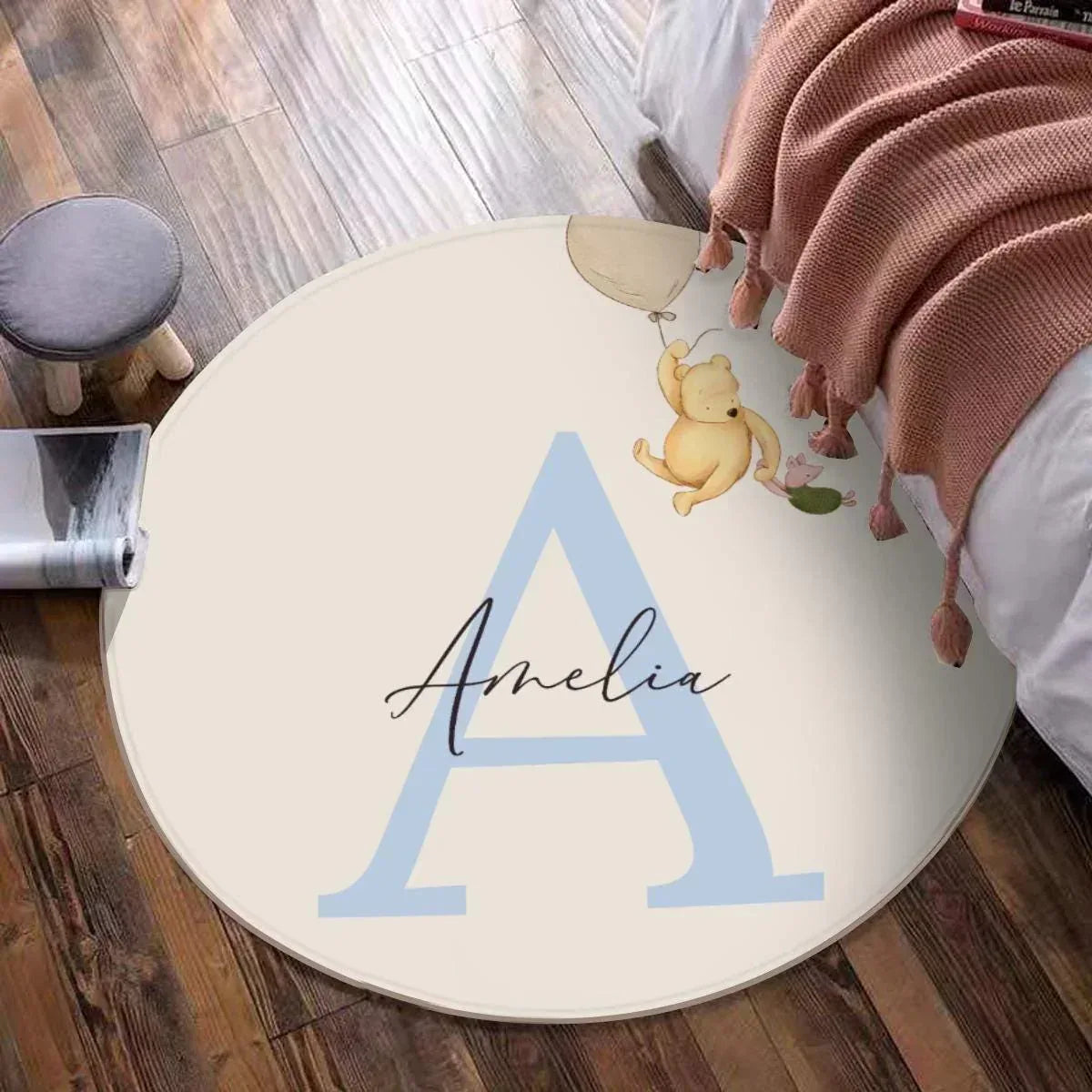 Classic Pooh Adventure rug styled in an elegant, neutral-toned baby nursery.