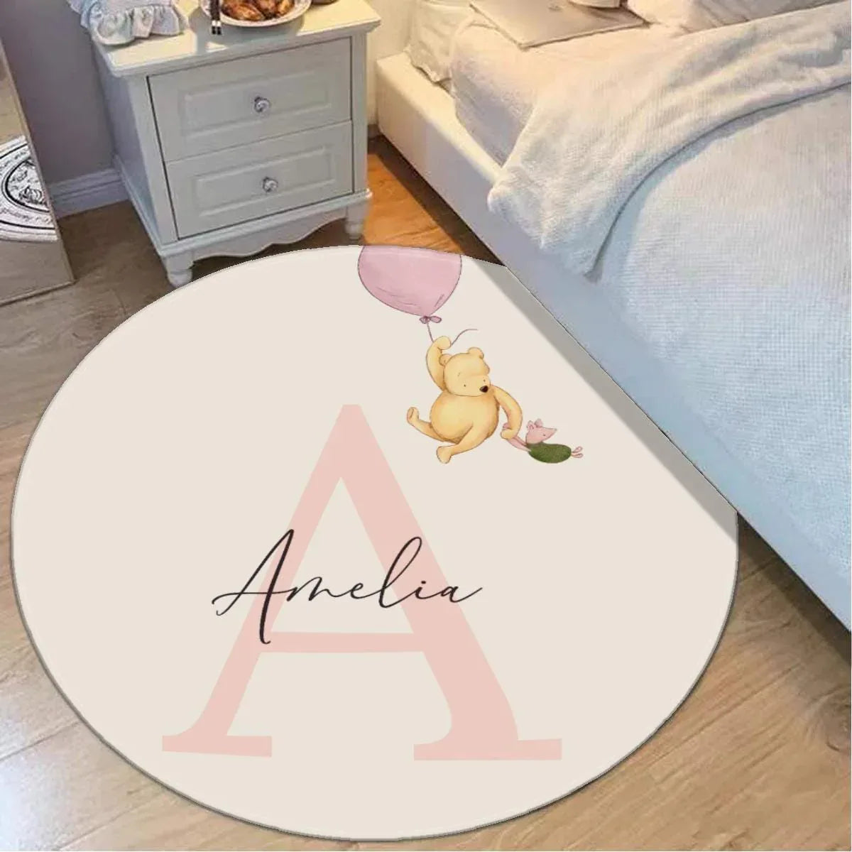 Personalized Winnie the Pooh balloon round nursery rug with custom initial.