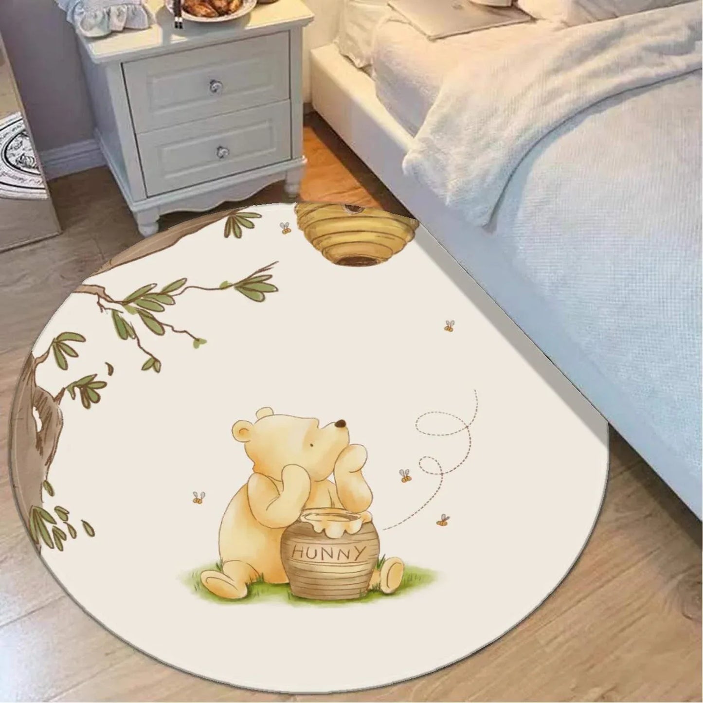 Close-up of premium machine-washable fabric texture on personalized Winnie the Pooh baby nursery rug.