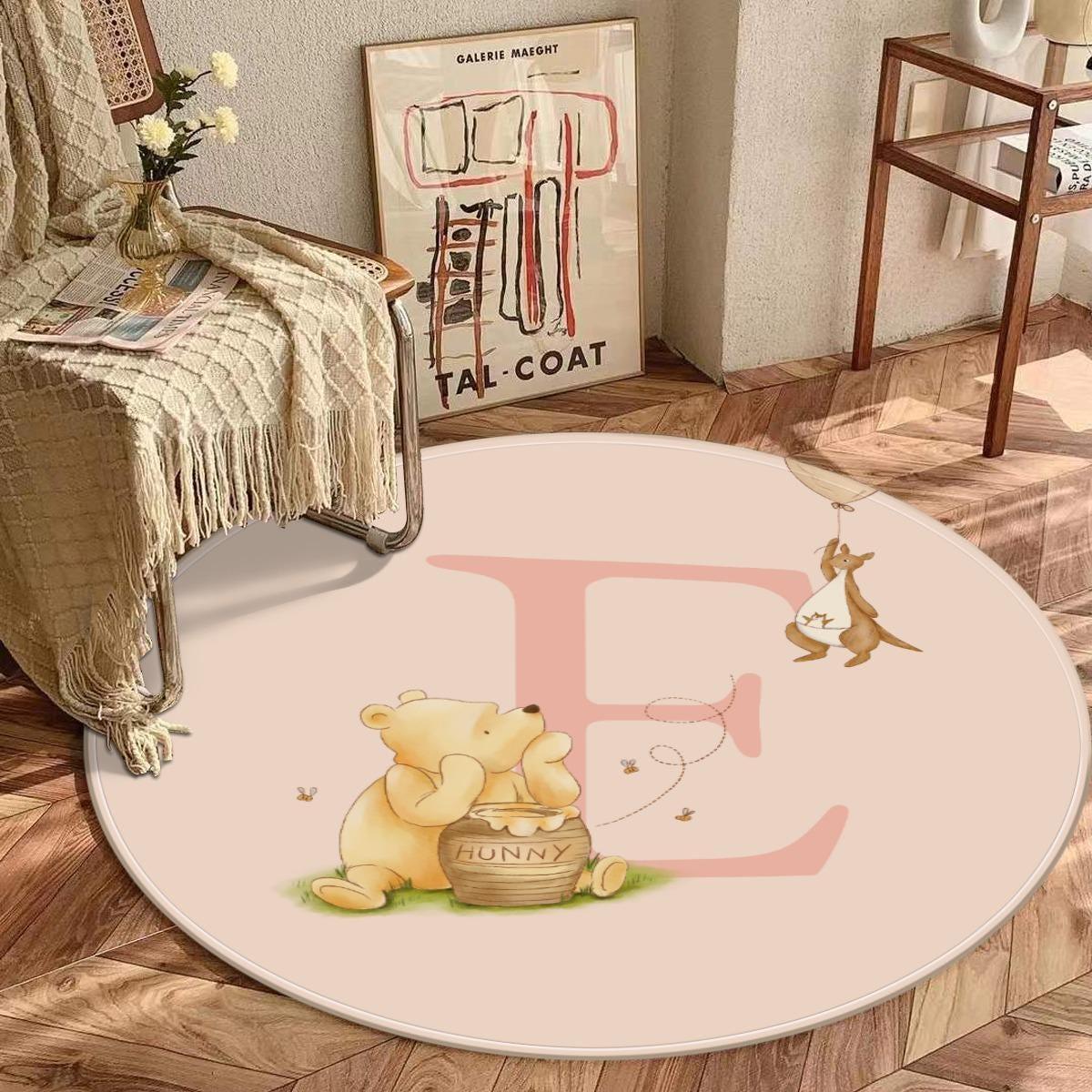 Custom initial detail on personalized Winnie the Pooh and Roo baby rug.