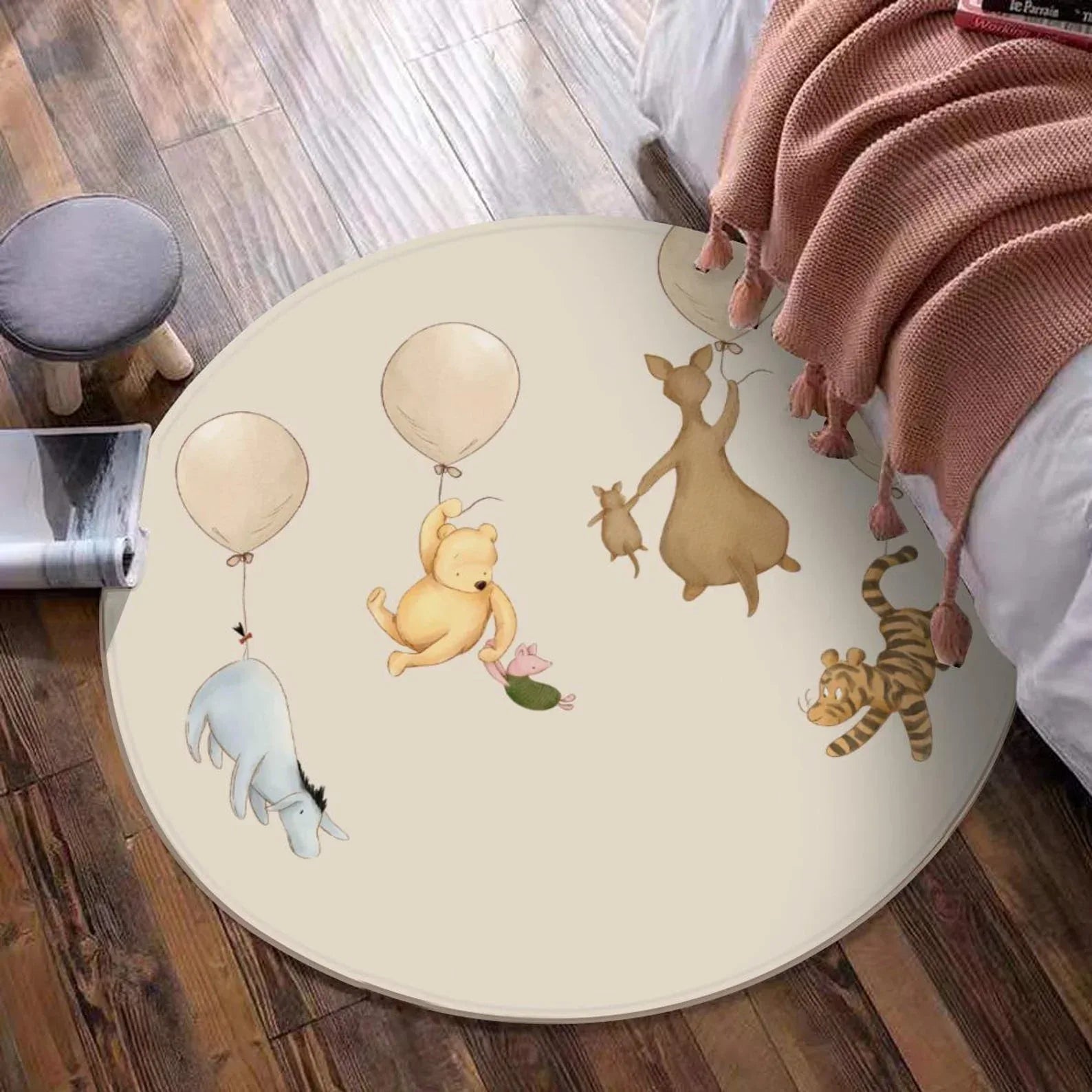 Winnie the Pooh and friends balloon rug styled in a modern nursery playroom.