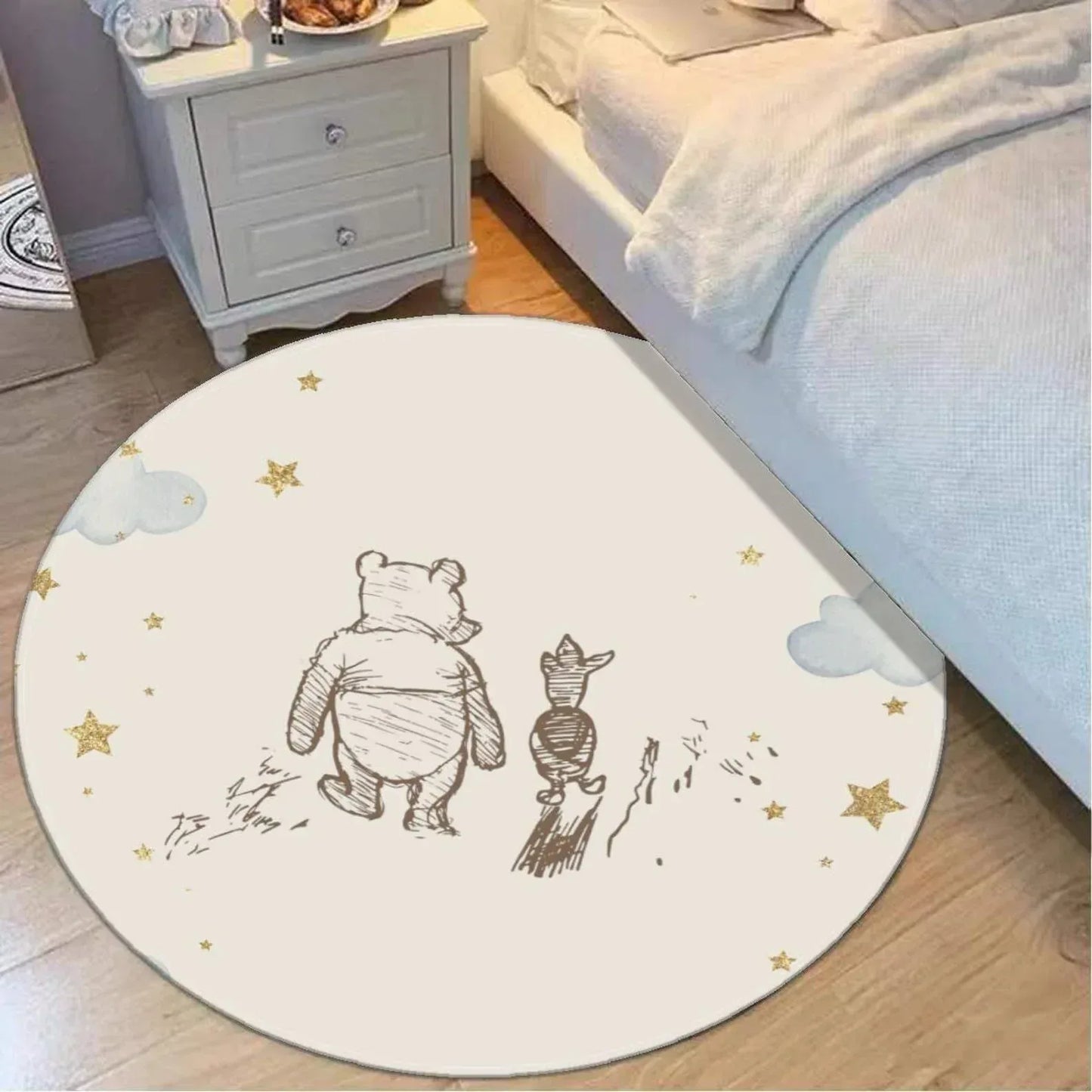 Winnie the Pooh nursery rug styled in a bright, modern storybook baby room.