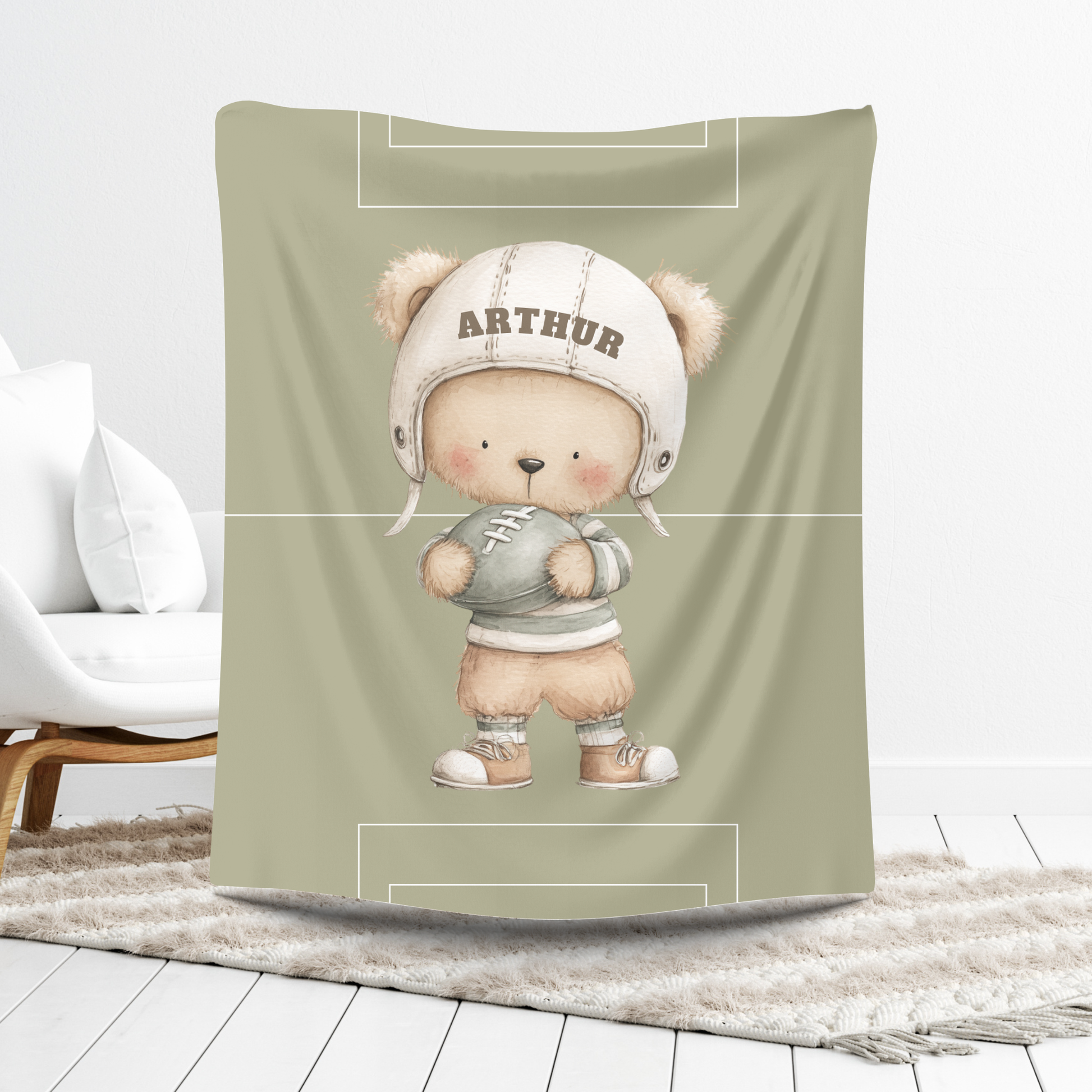 Close-up of football bear illustration on soft velvet nursery blanket.