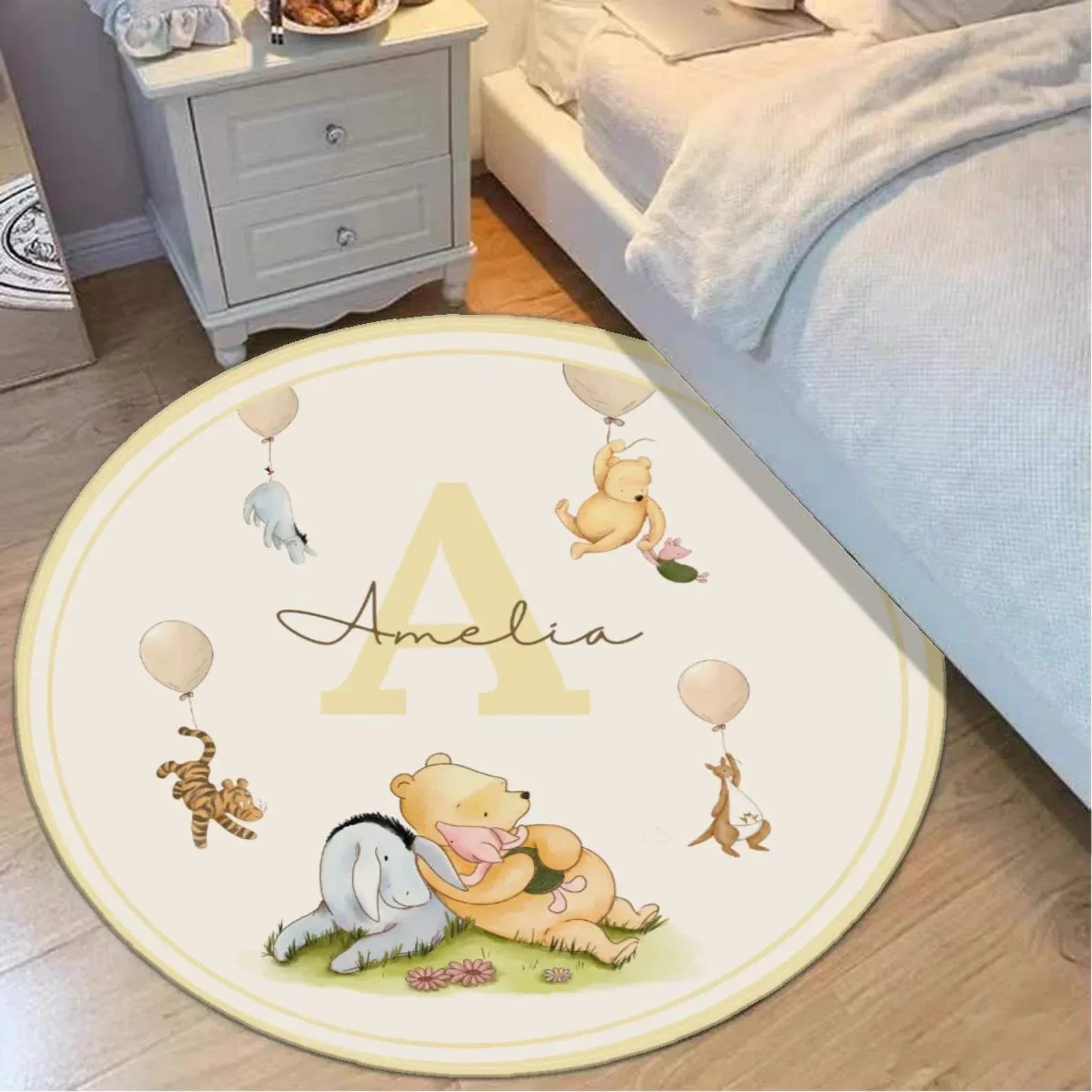 Close-up of buttery-soft, machine-washable fabric on personalized Pooh Bear round nursery rug.