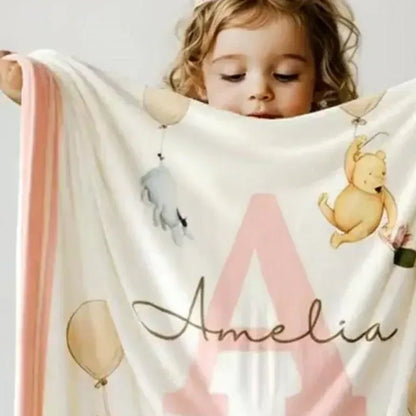 Close-up of personalized winnie the pooh and friend nursery blanket