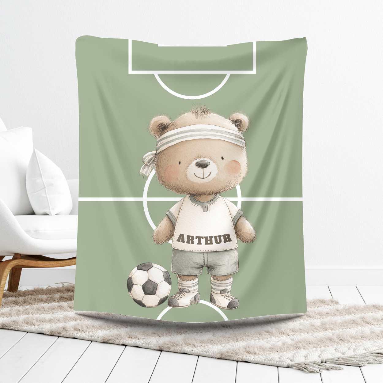 Close-up of soccer bear illustration on soft velvet nursery blanket.